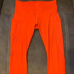 Athleta Contender stash pocket 7/8 fire orange